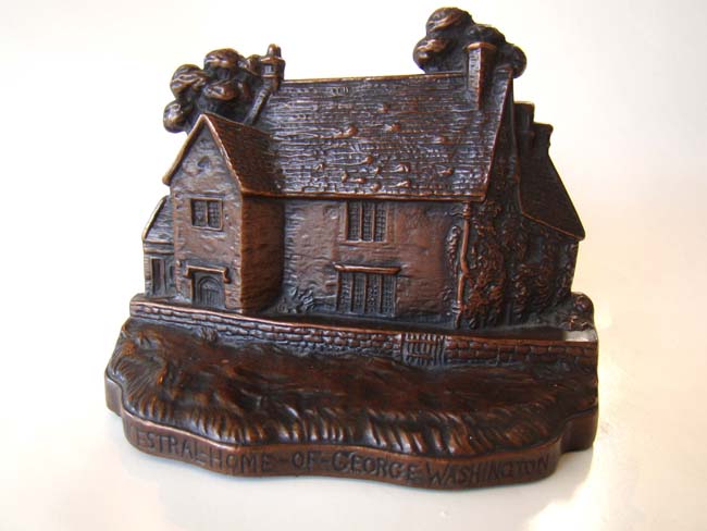 A pair of bookends depicting "Sulgrave Manor," the ancestral home of George Washington